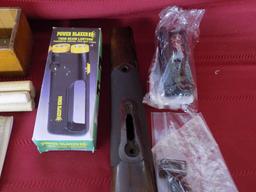 Lot of misc gun related items. trigger lock. trap gun forend. flashlight.