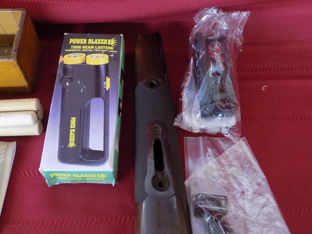 Lot of misc gun related items. trigger lock. trap gun forend. flashlight.