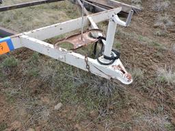 Tandem-Axle Flatbed Trailer Frame / 4 Tires have Tall Tread