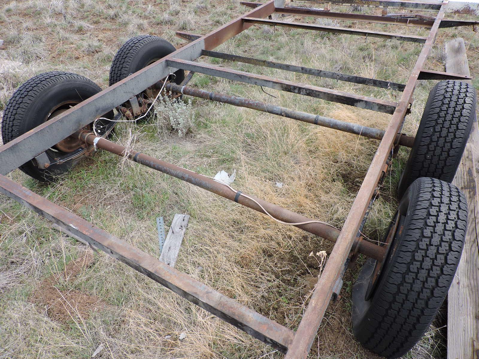 Tandem-Axle Flatbed Trailer Frame / 4 Tires have Tall Tread