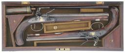 Cased Pair of Engraved Wogdon Marked Flintlock Pistols