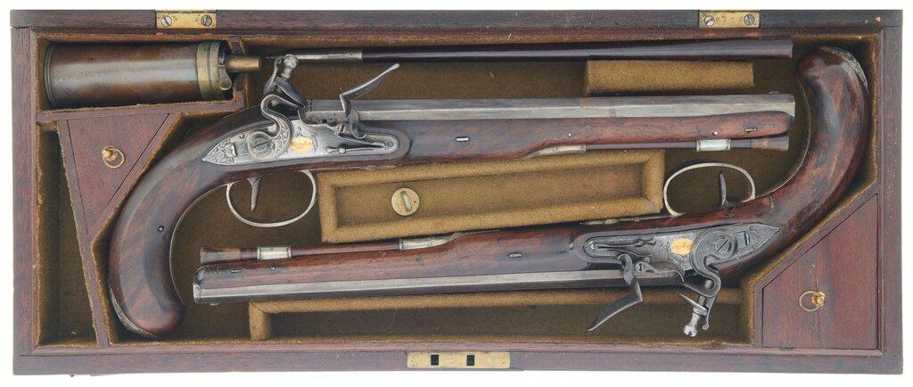 Cased Pair of Engraved Wogdon Marked Flintlock Pistols