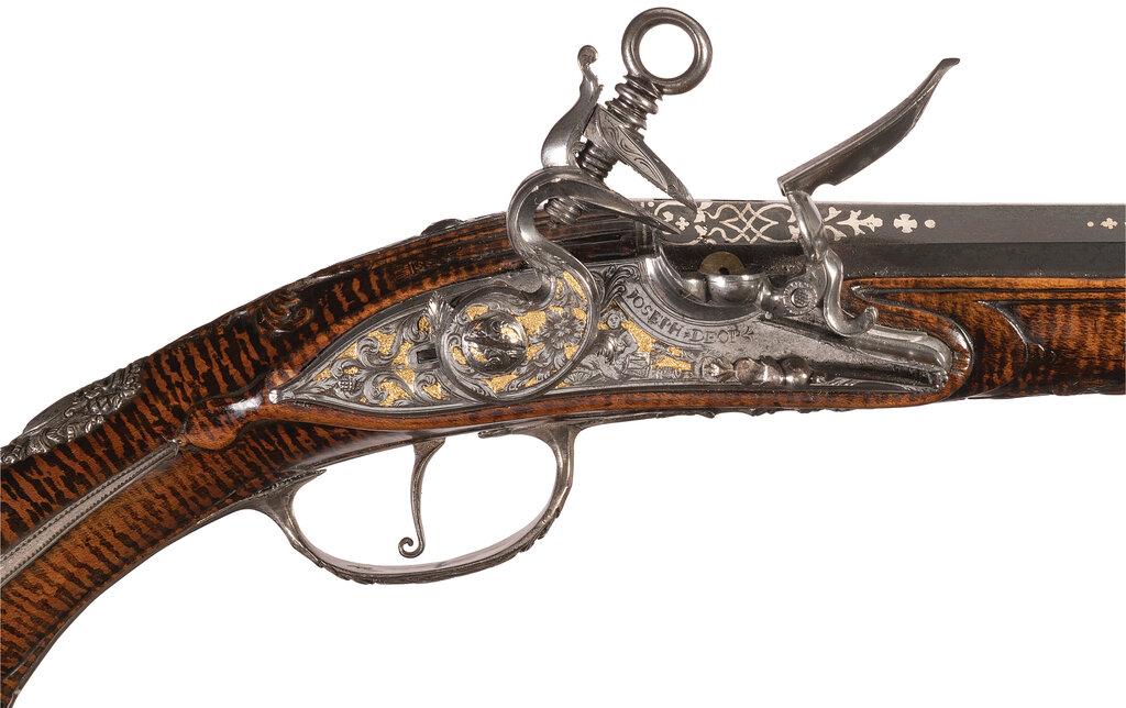 Pair of Ornate Silver Mounted Madrid-Lock Pistols