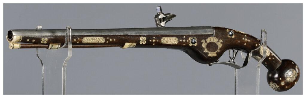 Ornate Wheellock Pistol with Engraved Stock Inlays