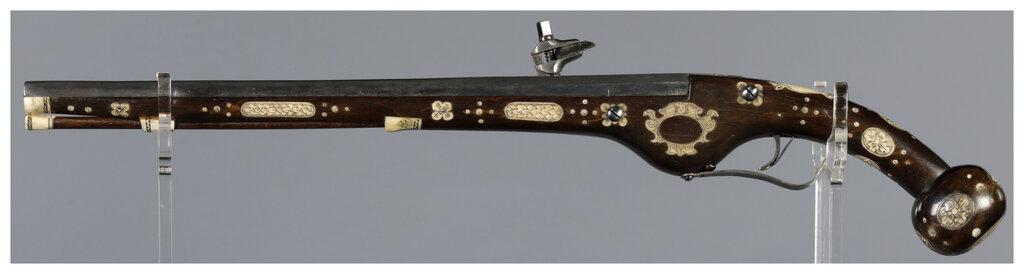 Ornate Wheellock Pistol with Engraved Stock Inlays