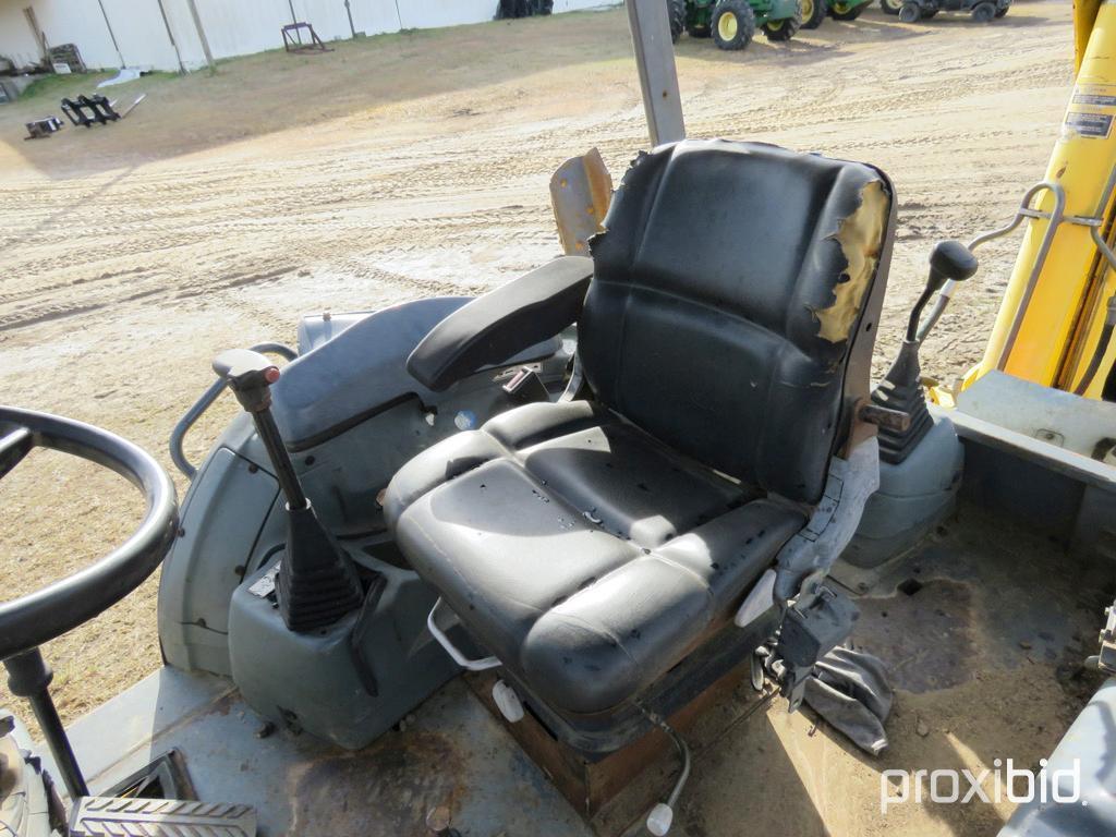 NEW HOLLAND LB75 BACKHOE 2WD OPEN-STATION W/ BUCKET & FORKS SN#031032951 (ODOMETER SHOWS: 4,600 HRS.