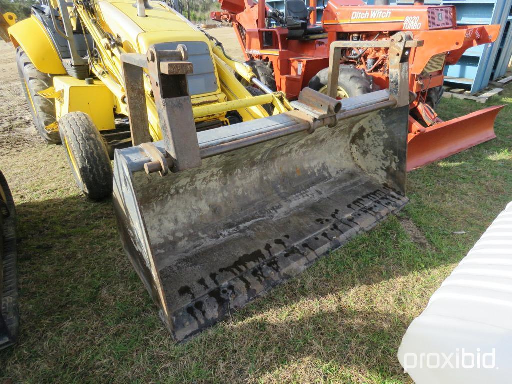 NEW HOLLAND LB75 BACKHOE 2WD OPEN-STATION W/ BUCKET & FORKS SN#031032951 (ODOMETER SHOWS: 4,600 HRS.