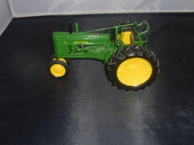 J.D. 1/16 tractor w/clock in wheel