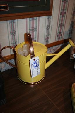 Yellow watering can
