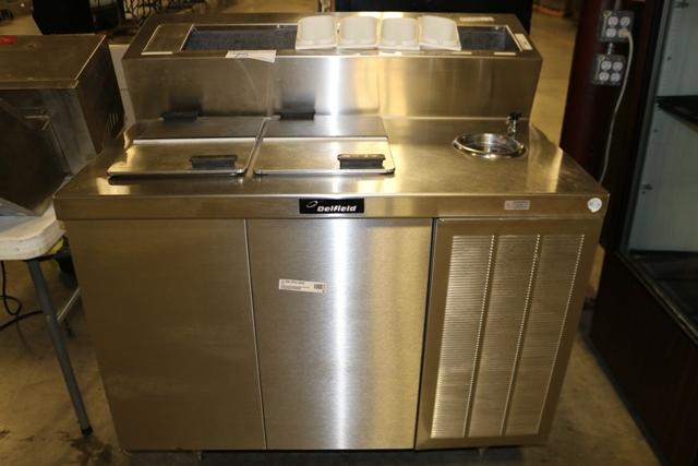 Delfield 44" ice cream dipping cabinet with raised topping rail and dip wel