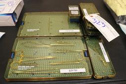 Eye Care & Cure plastic sterilization trays with some instruments