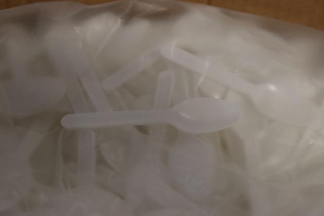 Case of white plastic taste tester spoons