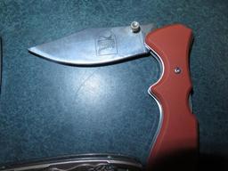 Misc new folding pocket knives including NRA, Pheasants Forever, Mossy Oak~