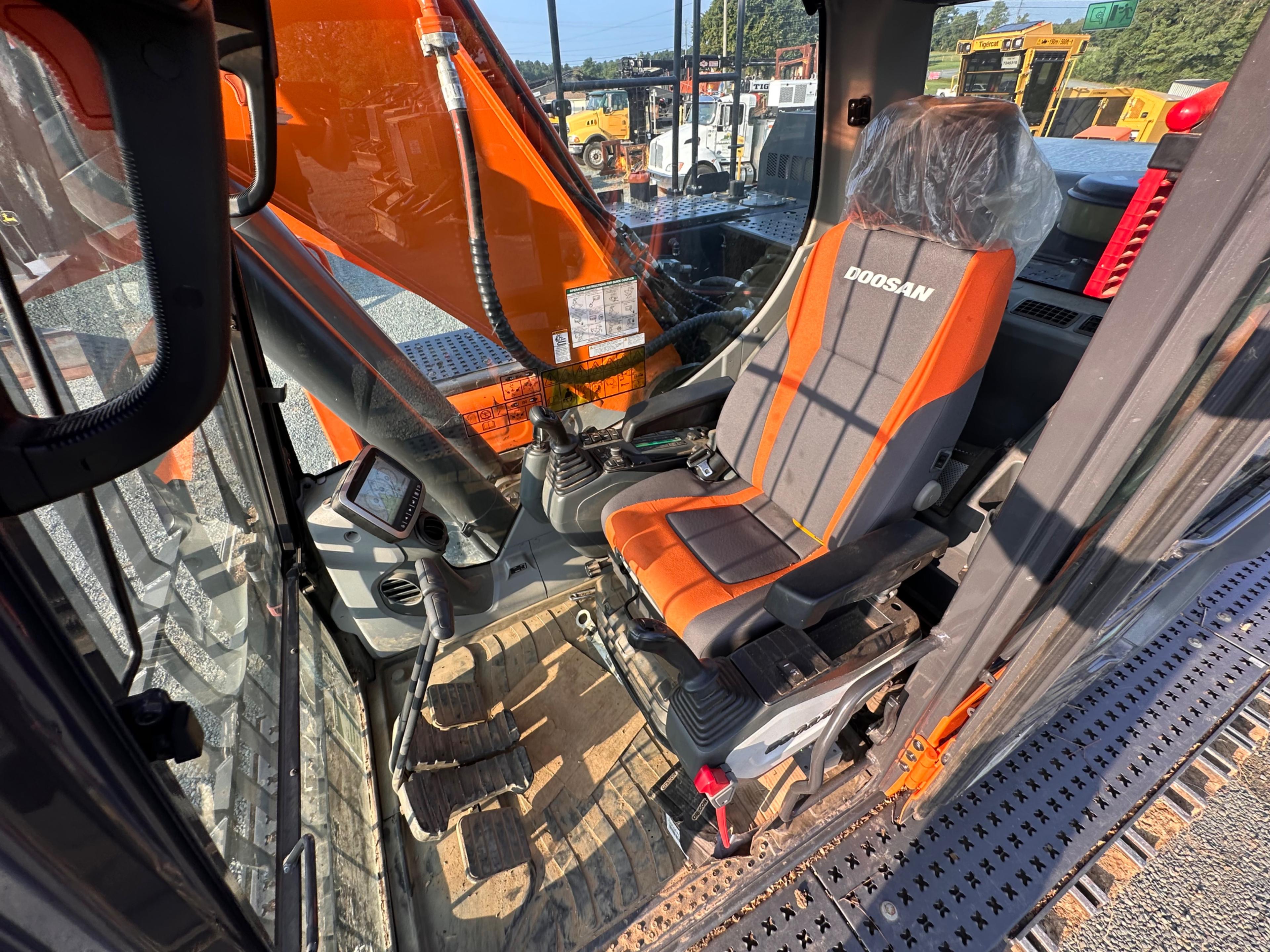 Doosan DX225LL Excavator With Rotodec Grapple Attachment
