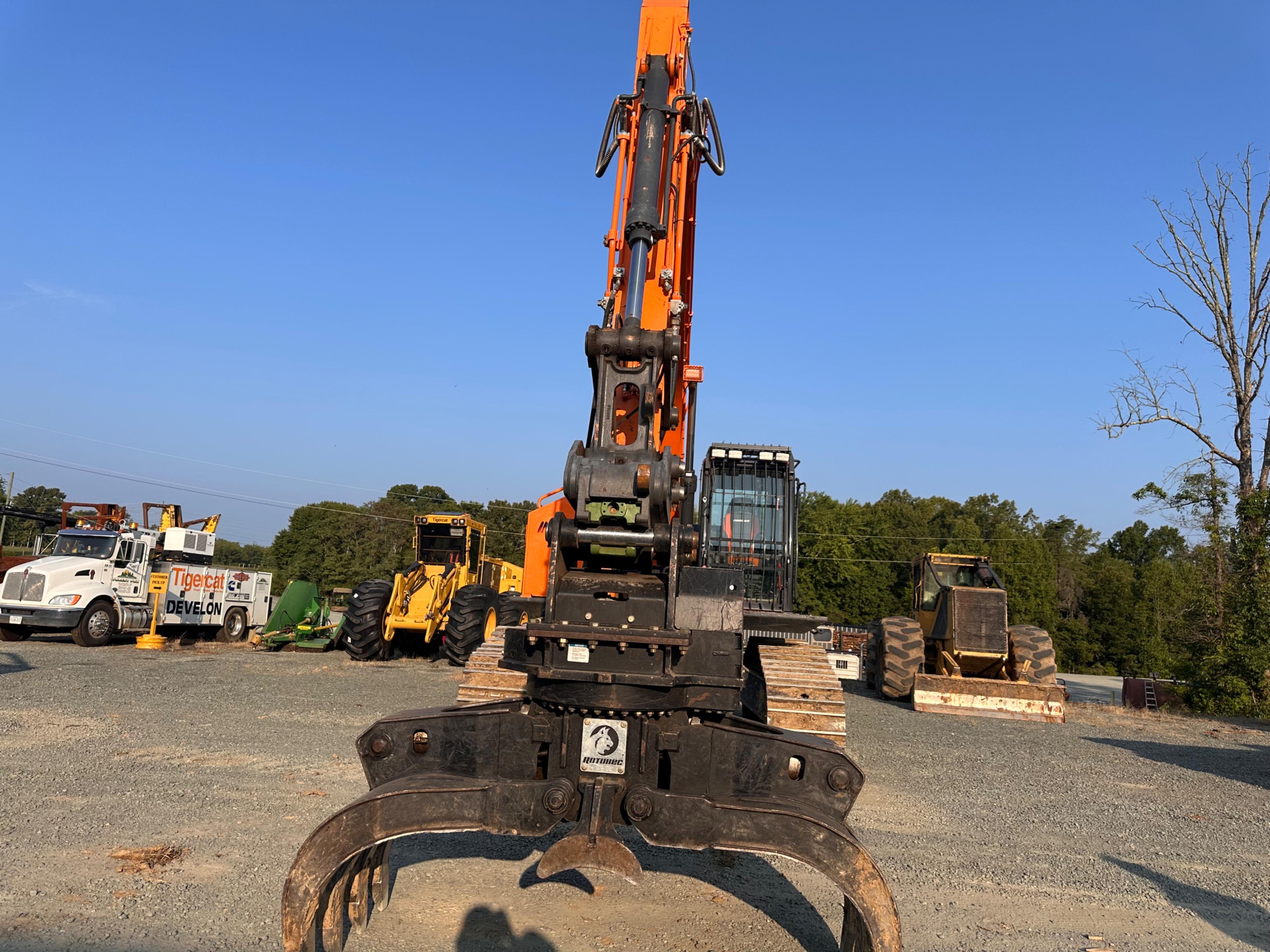 Doosan DX225LL Excavator With Rotodec Grapple Attachment