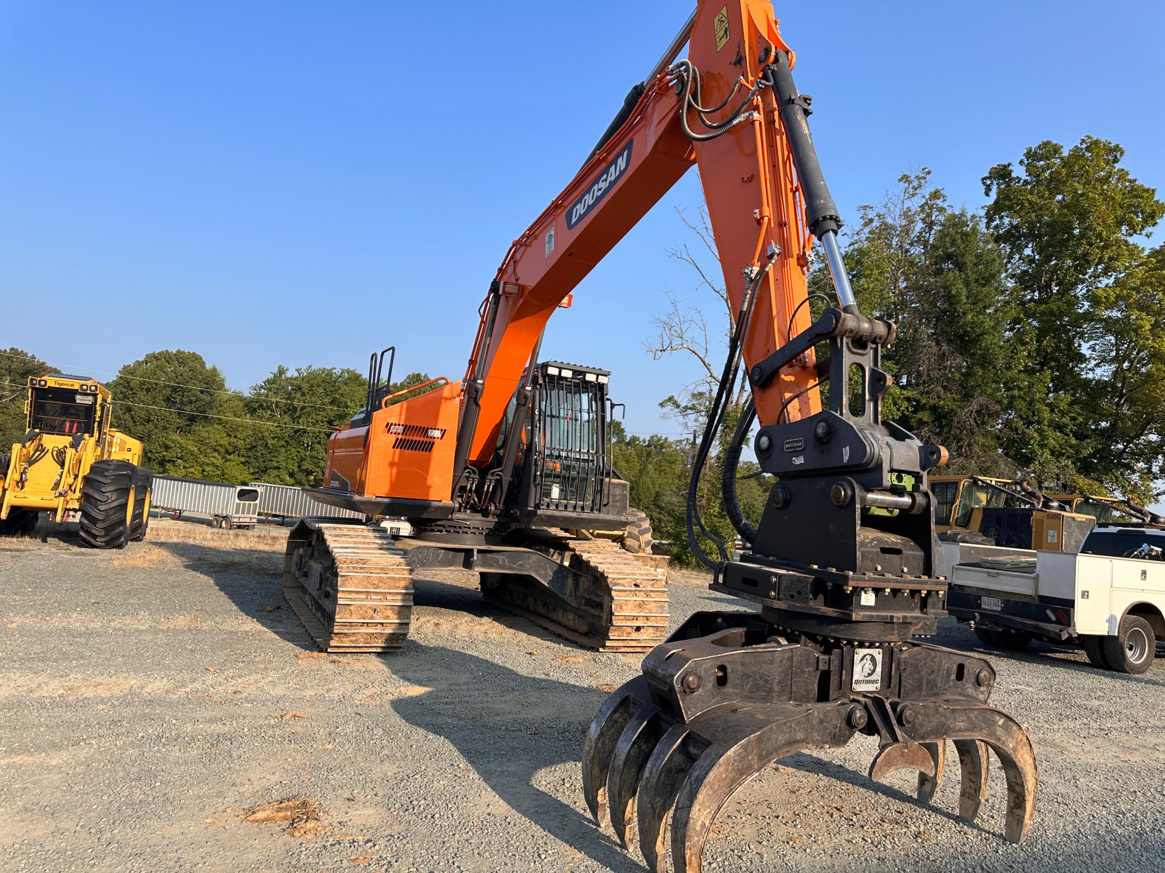 Doosan DX225LL Excavator With Rotodec Grapple Attachment