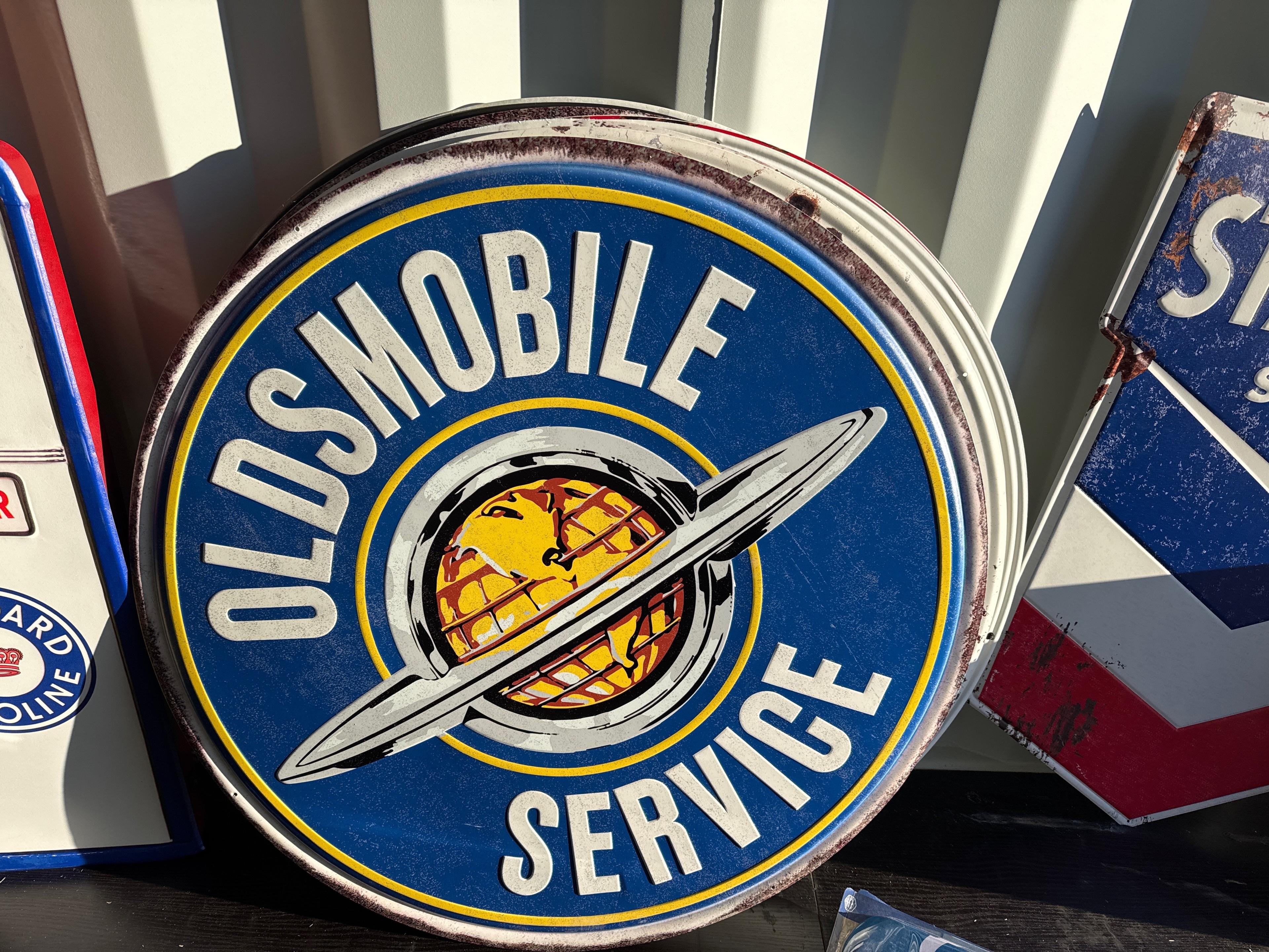 Oldsmobile service metal sign