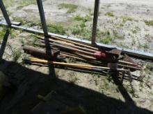 Assortment of shovels, rakes, garden tools