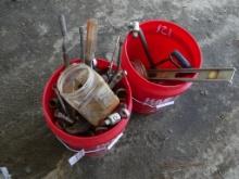 2 red buckets of wrenches