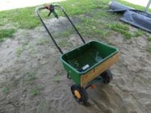 Walk behind seed spreader