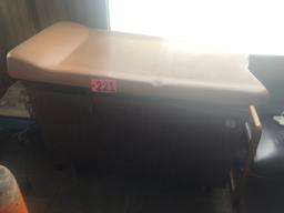 Adjustable exam table w/ built-in storage cabinet