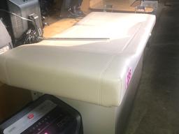 Adjustable exam table