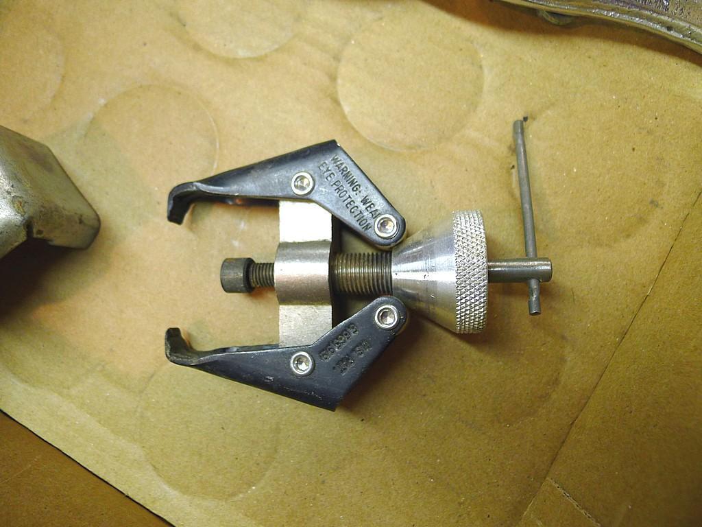 4" two jaw puller; three oil filter wrenches; smaller adjustable puller.
