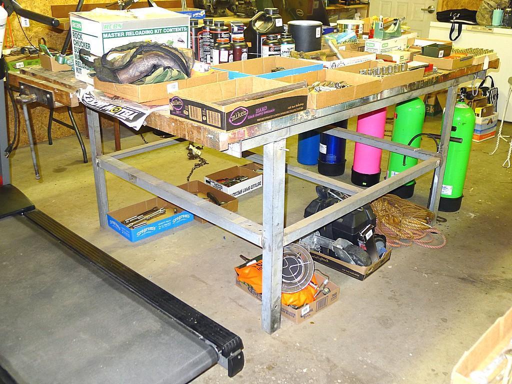 Great sturdy steel framed work bench measures 82" x 56" x 37" high. Each end has a vise mounted as