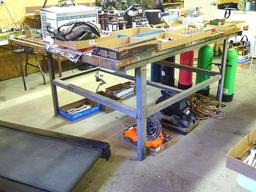 Great sturdy steel framed work bench measures 82" x 56" x 37" high. Each end has a vise mounted as