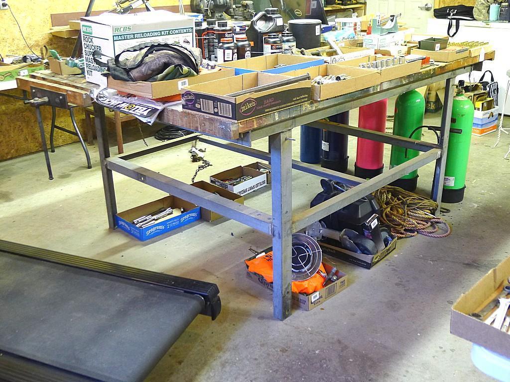 Great sturdy steel framed work bench measures 82" x 56" x 37" high. Each end has a vise mounted as