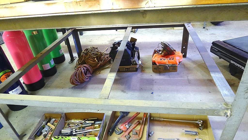 Great sturdy steel framed work bench measures 82" x 56" x 37" high. Each end has a vise mounted as