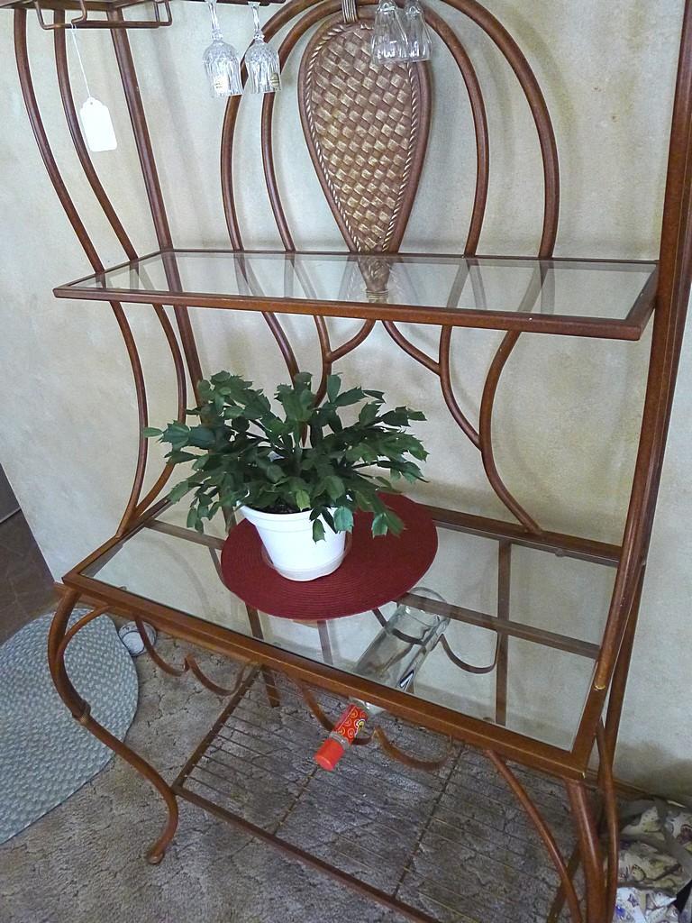 Metal framed wine rack with two glass shelves and a bottom wire shelf. Approx. 6' tall x 3' wide x