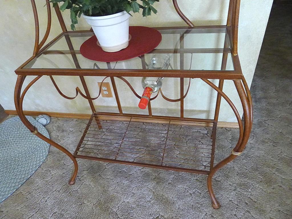 Metal framed wine rack with two glass shelves and a bottom wire shelf. Approx. 6' tall x 3' wide x
