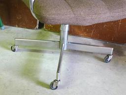 Brown padded swivel office chair. Rolls easily and is very comfortable.