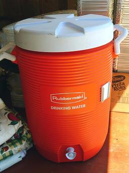 Rubbermaid 5 gallon water cooler, assorted vinyl tablecloths and one more. Some tablecloths have