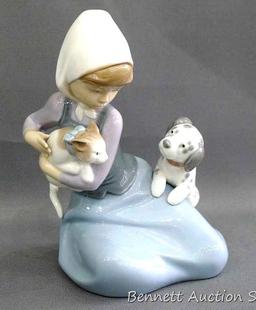 Lladro girl with dalmatian and cat figurine, marked 5032, D-20 E. Stands 7". In very good condition