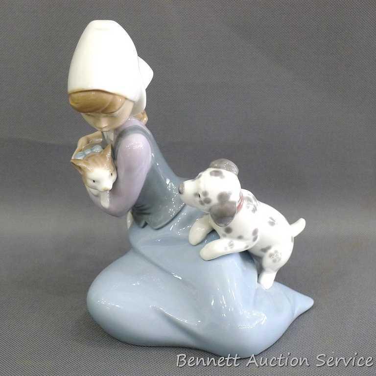 Lladro girl with dalmatian and cat figurine, marked 5032, D-20 E. Stands 7". In very good condition