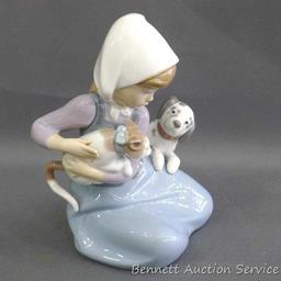 Lladro girl with dalmatian and cat figurine, marked 5032, D-20 E. Stands 7". In very good condition