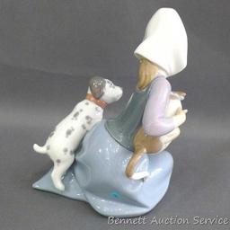 Lladro girl with dalmatian and cat figurine, marked 5032, D-20 E. Stands 7". In very good condition