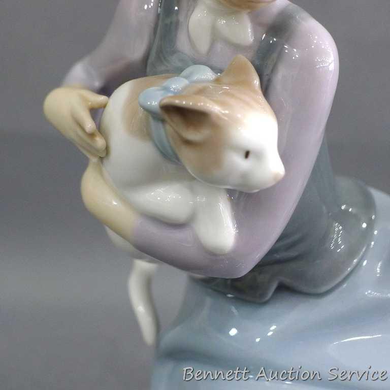 Lladro girl with dalmatian and cat figurine, marked 5032, D-20 E. Stands 7". In very good condition
