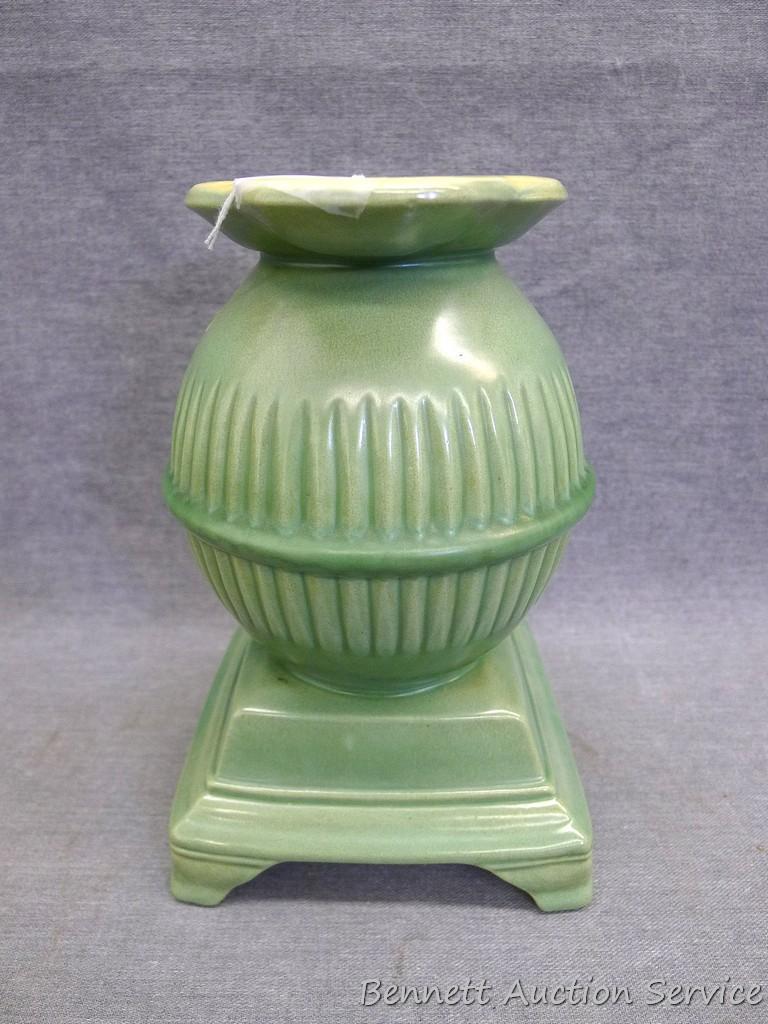 Red Wing art pottery pot belly stove planter is marked on bottom '765'. Planter stands 8" tall and