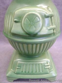Red Wing art pottery pot belly stove planter is marked on bottom '765'. Planter stands 8" tall and