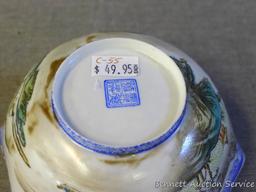 Egg shell porcelain Oriental octagonal bowl depicts mountain scene and comes with storage box. Bowl