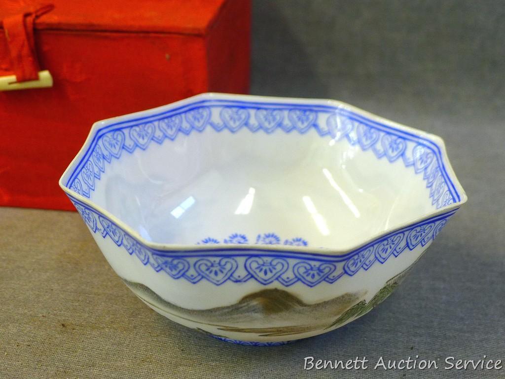 Egg shell porcelain Oriental octagonal bowl depicts mountain scene and comes with storage box. Bowl