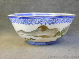 Egg shell porcelain Oriental octagonal bowl depicts mountain scene and comes with storage box. Bowl