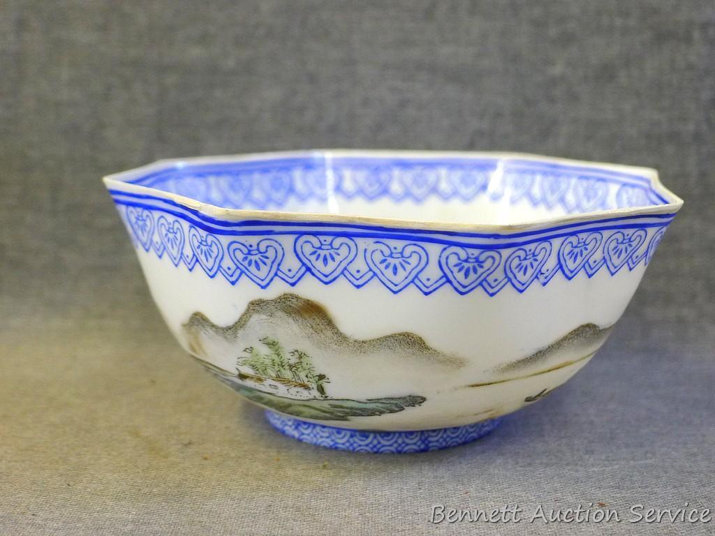 Egg shell porcelain Oriental octagonal bowl depicts mountain scene and comes with storage box. Bowl