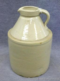 Stoneware syrup pitcher stands approx. 8-1/2" tall and is in overall good condition with only one