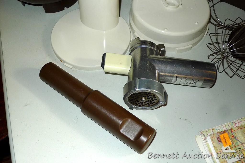 West Bend food processor includes meat grinder, cutting discs, and whisk attachments. Powers up.