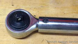 Sears Craftsman 3/8" drive torque wrench includes foot lbs. and newton meters. Comes with plastic