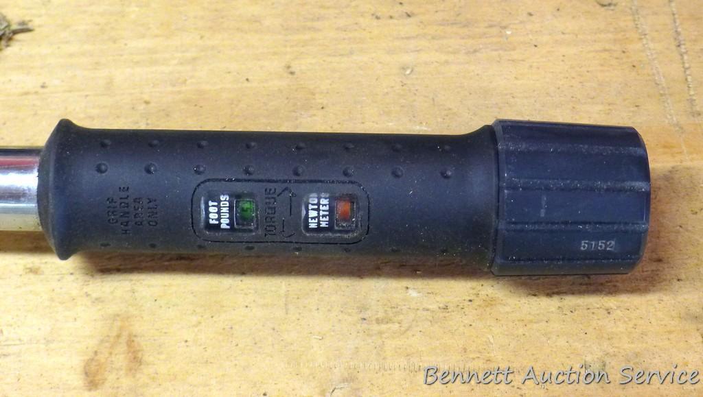 Sears Craftsman 3/8" drive torque wrench includes foot lbs. and newton meters. Comes with plastic